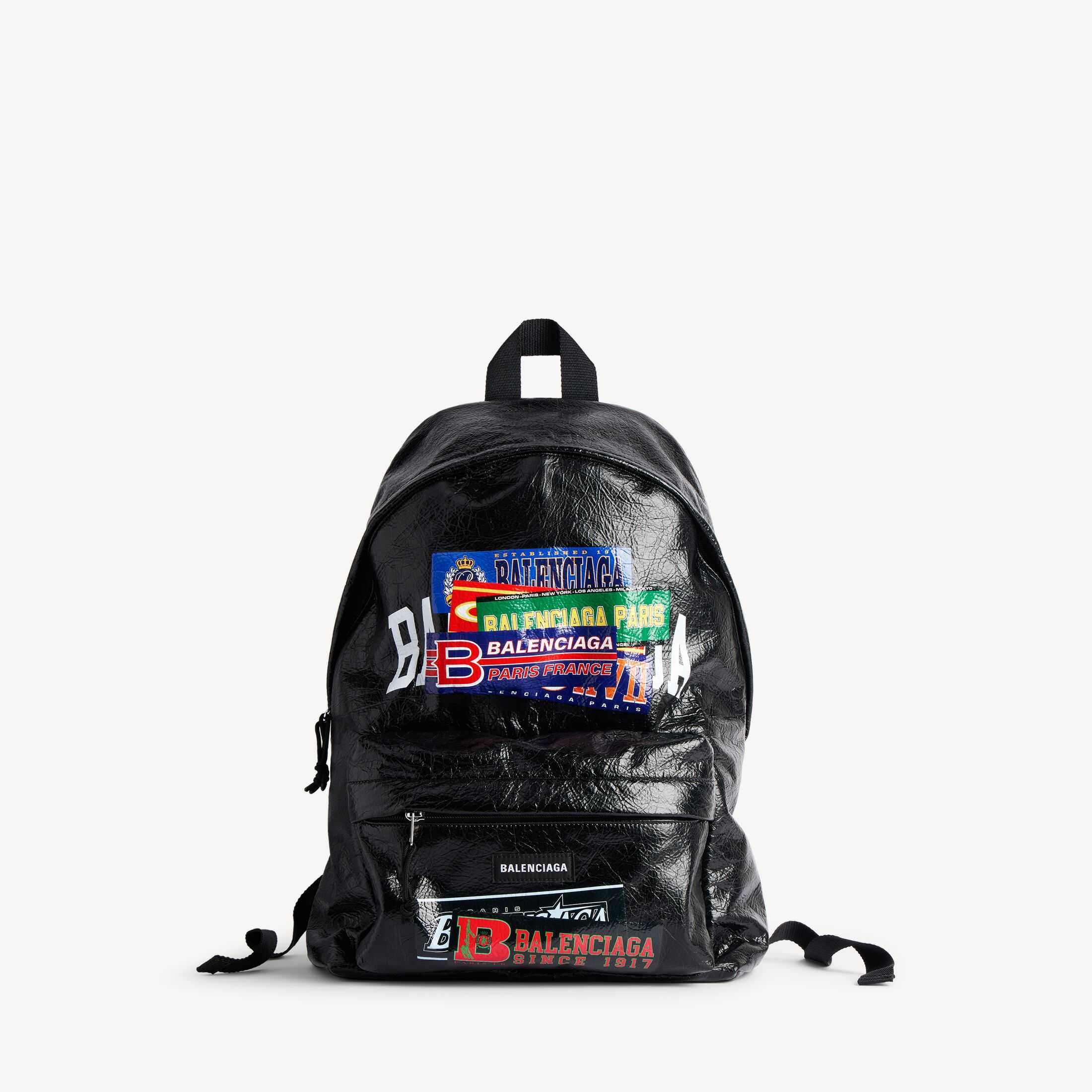 复刻高端Balenciaga高仿A货男士皮具1:1原单Explorer高品质仿制品spanExplorer黑色和彩色bumper stickers艺术作品细纹羊皮革双肩包